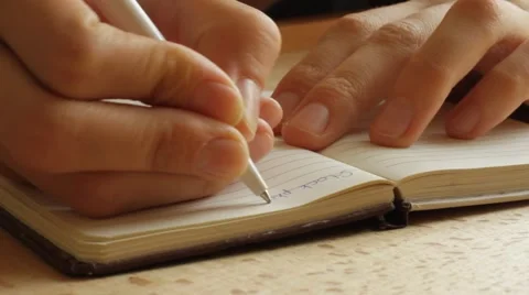 Hands writing on the paper, closeup Stock Footage 59763686