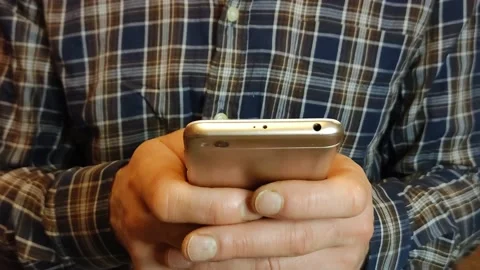 Hands writing a text message or downloading a mobile phone app Stock Footage 186553600