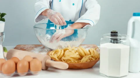 Hands of young baker in the flour isolated on white. Child smiling at camera Video stock 68085570