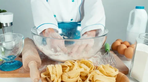 Hands of young baker girl in the flour. Close up short Stock Footage