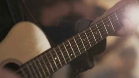 Hands of a Young Man Playing Classic Wooden Guitar Stock Footage 74492165