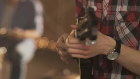 Hands of a Young Man Playing Ukulele Stock Footage 74492731