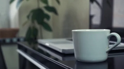 Hands of young man pouring steaming coffee into cup at kitchen. Stock Footage 82933268