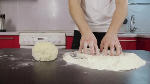 Hands of young man prepare dough Video stock 127689716