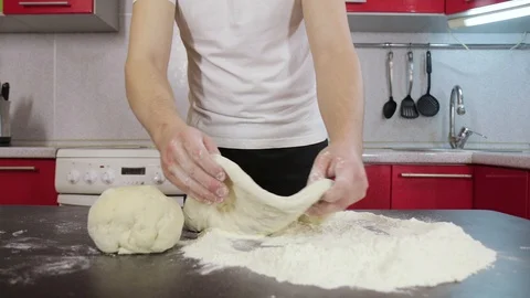 Hands of young man prepare dough Video stock 127689812