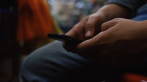 Hands of young man typing on the phone. Selective focus Video stock 93572627