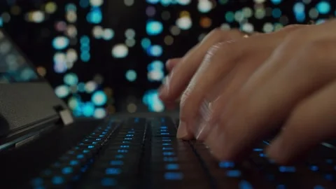 Hands of a young man working at a computer. The programmer is typing on a gaming Video stock 163780981