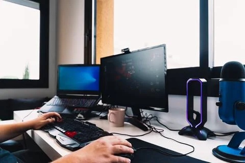 Hands of a young man working as a programmer from home on his computer. Stock-Fotos