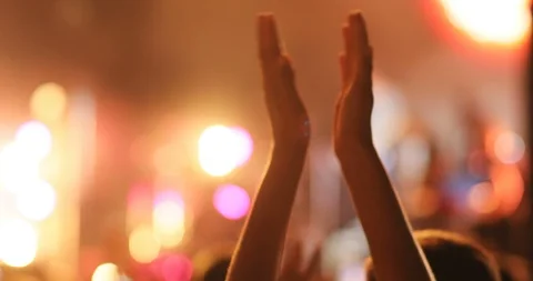 Hands of young person applauding. Fans at concert of popular foreign musical Stock Footage