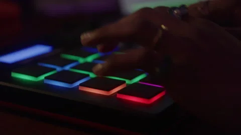 Hands of Young Person Pressing Multiple Light-up Buttons on Control Pad Stock Footage 222008876