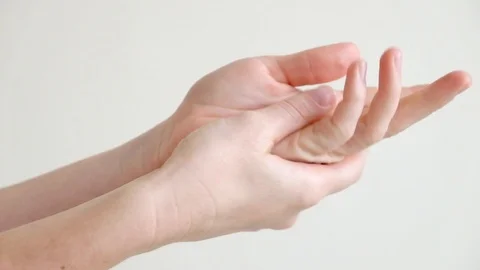 Hands of a young woman applying hand cream Stock Footage