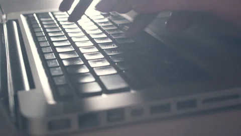 Hands of a young woman on computer keyboard. The camera is in motion - on dolly Stock-Footage 87342996