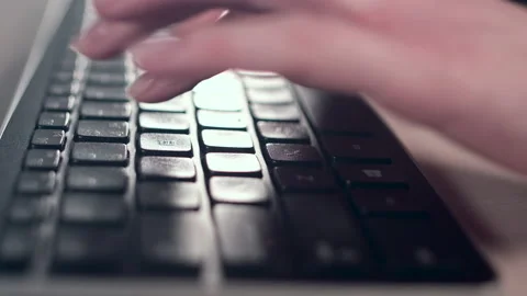 Hands of a young woman on computer keyboard. The camera is in motion - on dolly Stock Footage 87366929