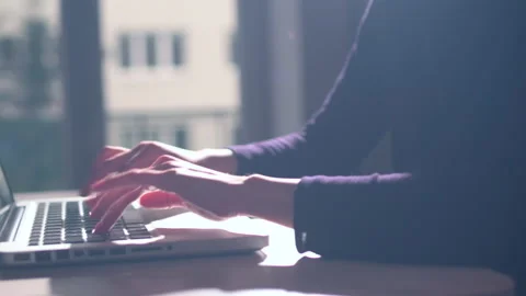 Hands of a young woman on computer keyboard. The camera is in motion - on dolly Stock Footage 87368904