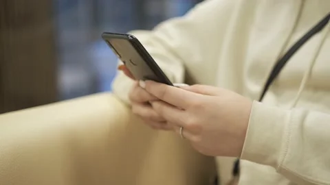 Hands of young woman using smartphone in shopping mall. Communication, online Stock Footage 168241118