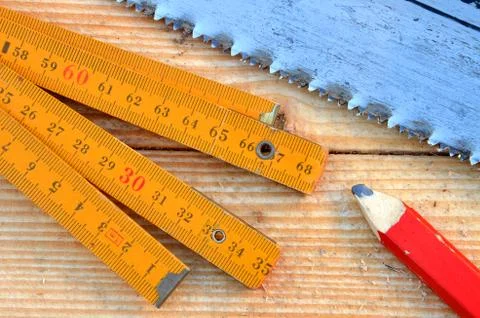 Handsaw, carpenter meter, pencil Stock Photos