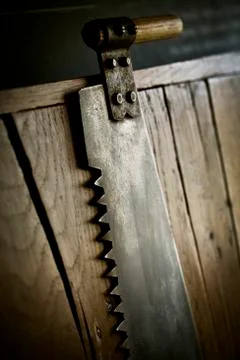 A handsaw handtool, with a handle and sharp serrated edge. Stockfoto's