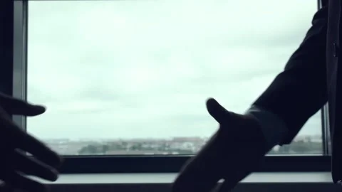 Handshake against the window. Stock Footage
