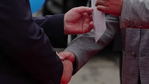 Handshake and presentation of certificate to employee at work, close-up of mens Stock Footage 306365302
