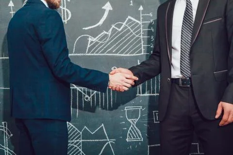 Handshake. Background with charts Foto stock