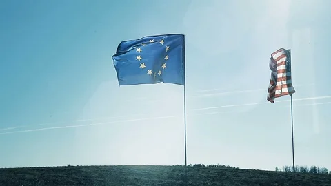 Handshake on the background of the flags of America and the European Union Stock Footage 97352809