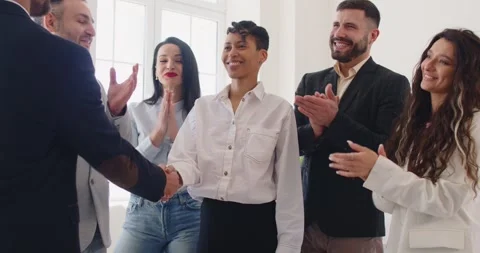 Handshake between boss and happy best female employee in recognition of work Stock Footage 314967057