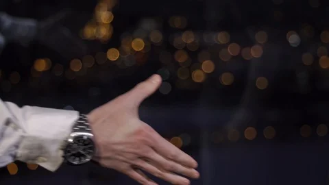 Handshake between clear and tattooed hands Stock Footage 89138627