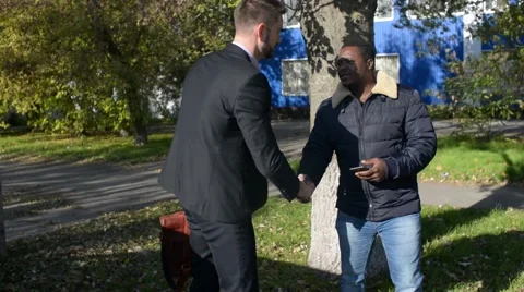 Handshake Between Two Men on the Street - Day Video stock 68935853