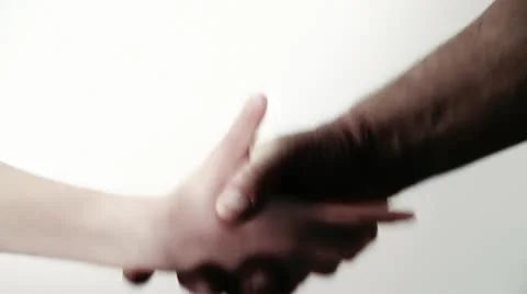 Handshake. Black and white. Reconciliation. Friendship. White Background. Stock Footage 10860208