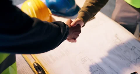 Handshake, blueprint and construction workers on site with agreement, Stock Footage 337014642