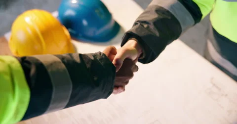 Handshake, blueprint or construction workers on site with deal, partnership or Stock Footage 337015332