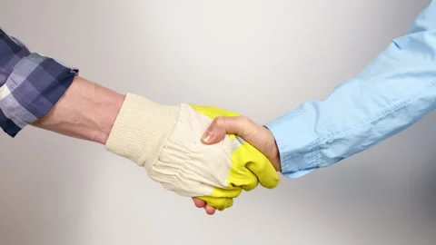 Handshake of a builder in a glove and a client. Stock Footage 235051775