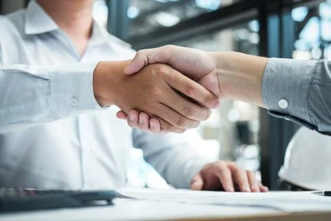 Handshake of collaboration, Construction engineering or architect discuss a b Stock Photos
