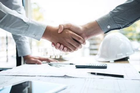 Handshake of collaboration, Construction engineering or architect discuss a b Stock Photos