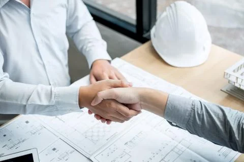 Handshake of collaboration, Construction engineering or architect discuss a b Stock Photos