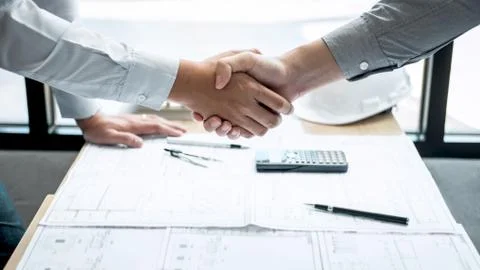 Handshake of collaboration, Construction engineering or architect discuss a b Stock Photos