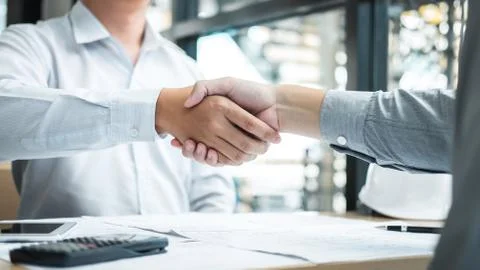 Handshake of collaboration, Construction engineering or architect discuss a b Stock Photos