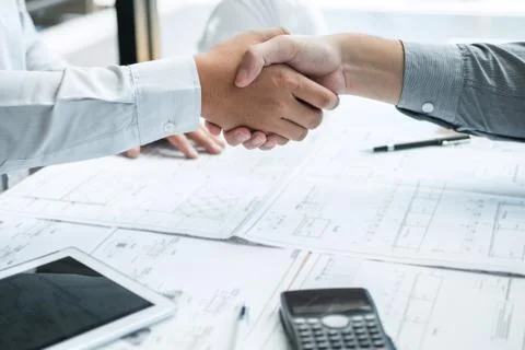 Handshake of collaboration, Construction engineering or architect discuss a b Stock Photos