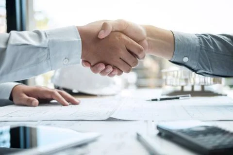 Handshake of collaboration, Construction engineering or architect discuss a b Stock Photos
