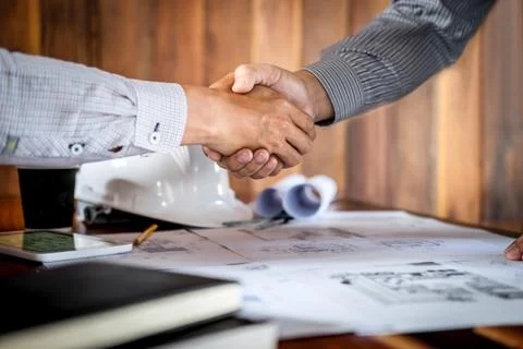 Handshake of collaboration, Construction engineering or architect discuss a b Stock Photos