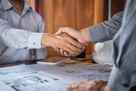 Handshake of collaboration, Construction engineering or architect discuss a b Stock Photos