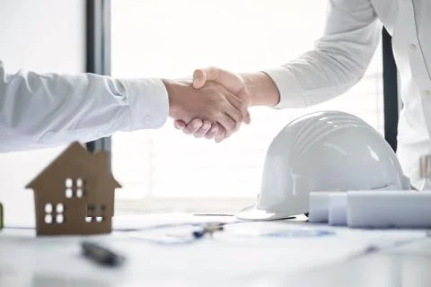 Handshake of collaboration, Construction engineering or architect discuss a b Stock Photos