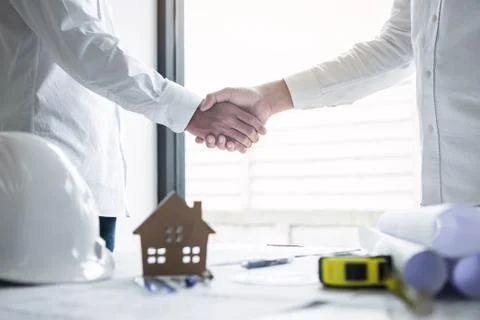 Handshake of collaboration, Construction engineering or architect discuss a b Stock Photos