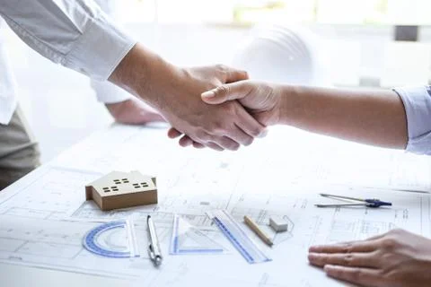 Handshake of collaboration, Construction engineering or architect discuss a b Stock Photos