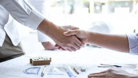Handshake of collaboration, Construction engineering or architect discuss a b Stock Photos
