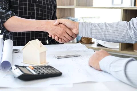 Handshake of collaboration, Construction engineering or architect discuss a b Stock Photos