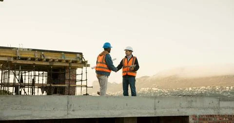 Handshake, construction and men on rooftop for meeting, agreement and approval Stock Photos
