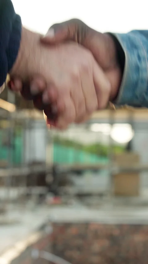 Handshake, construction site and people in partnership with flare, agreement and Stock Footage 340888841