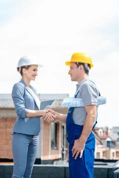 Handshake on construction site between developer and builder 写真素材