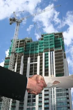 Handshake with construction site Stock Illustration